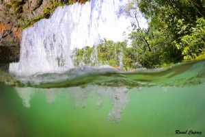 Behind the waterfall by Raoul Caprez 
